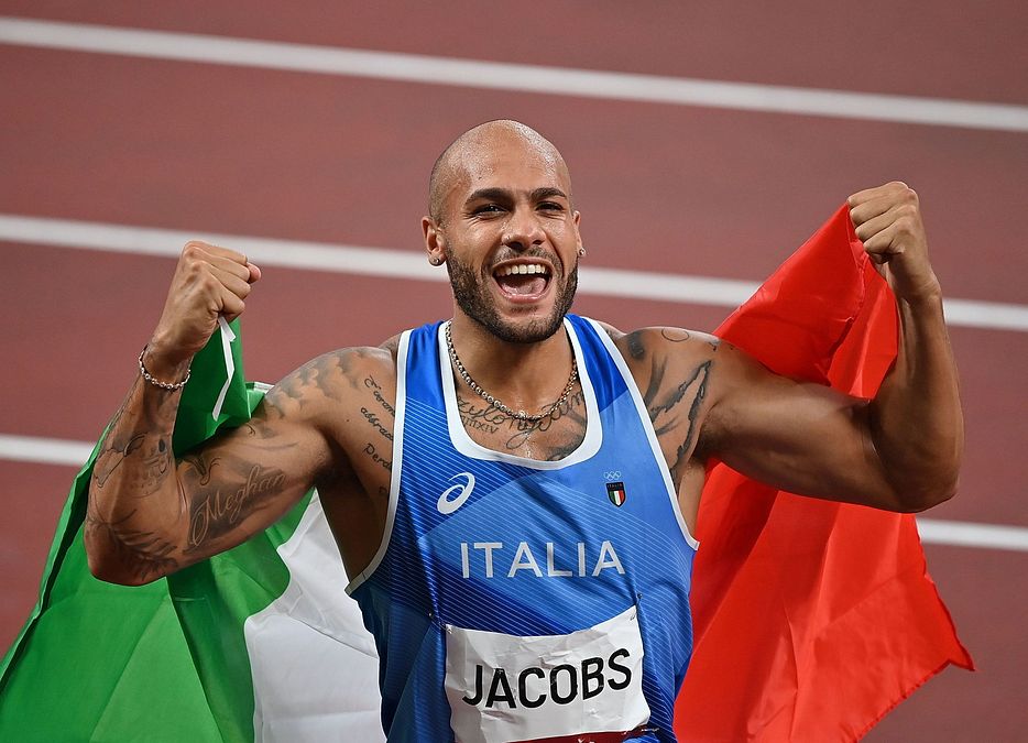 Marcell Jacobs believe cross tattoo