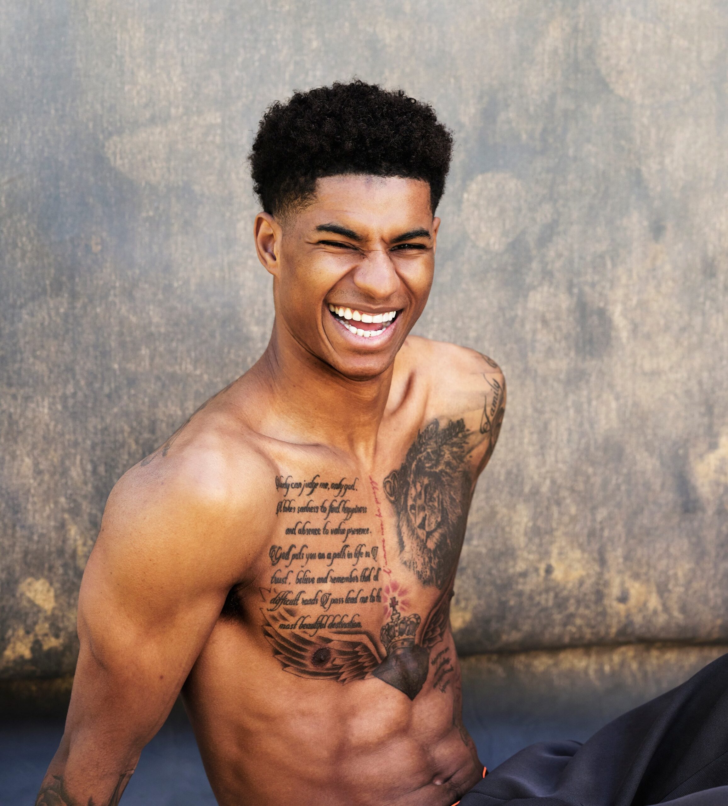 Marcus Rashford chest lion and script tattoos alternate view