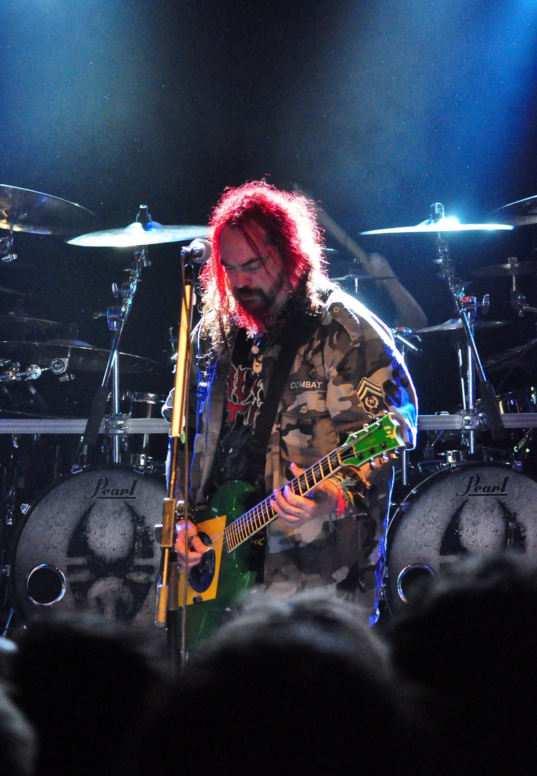 Max Cavalera face and arm tattoos on stage