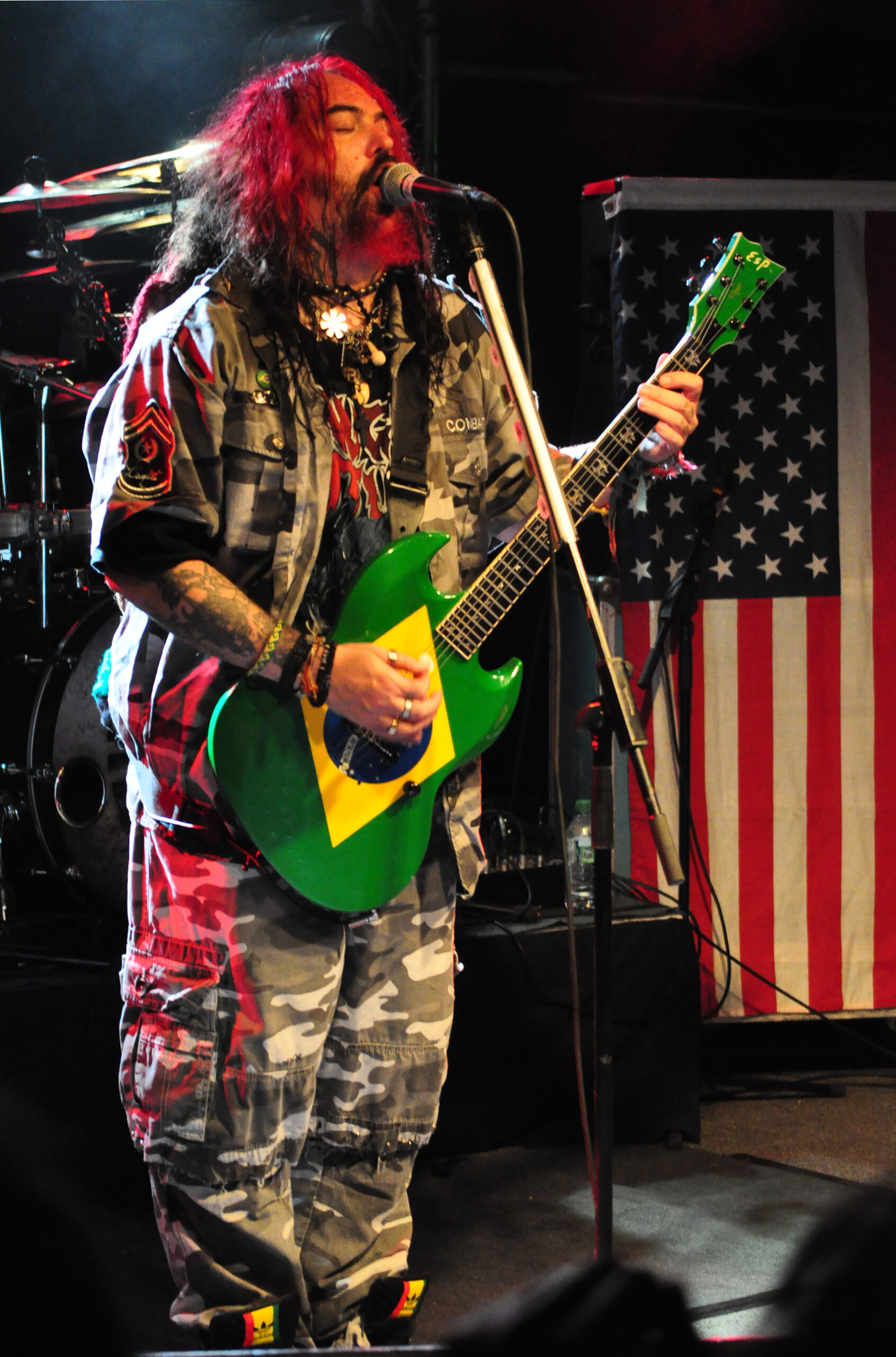Max Cavalera neck and arm tattoos on stage