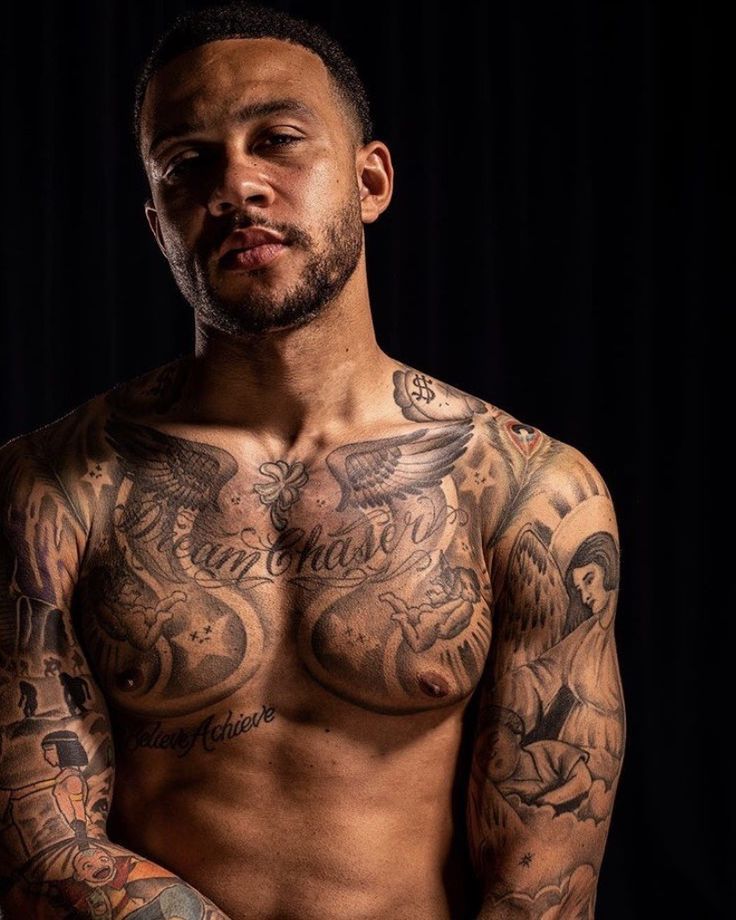 Memphis Depay Dream Believe Achieve chest tattoo