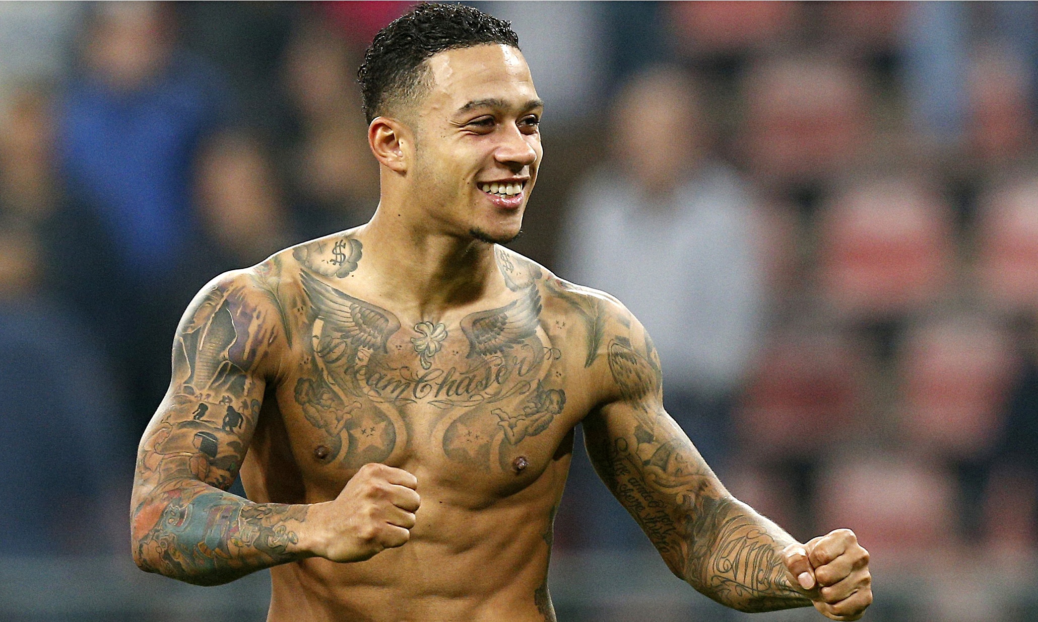 Memphis Depay lion tattoo across his back
