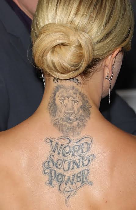 Mena Suvari spine tattoo