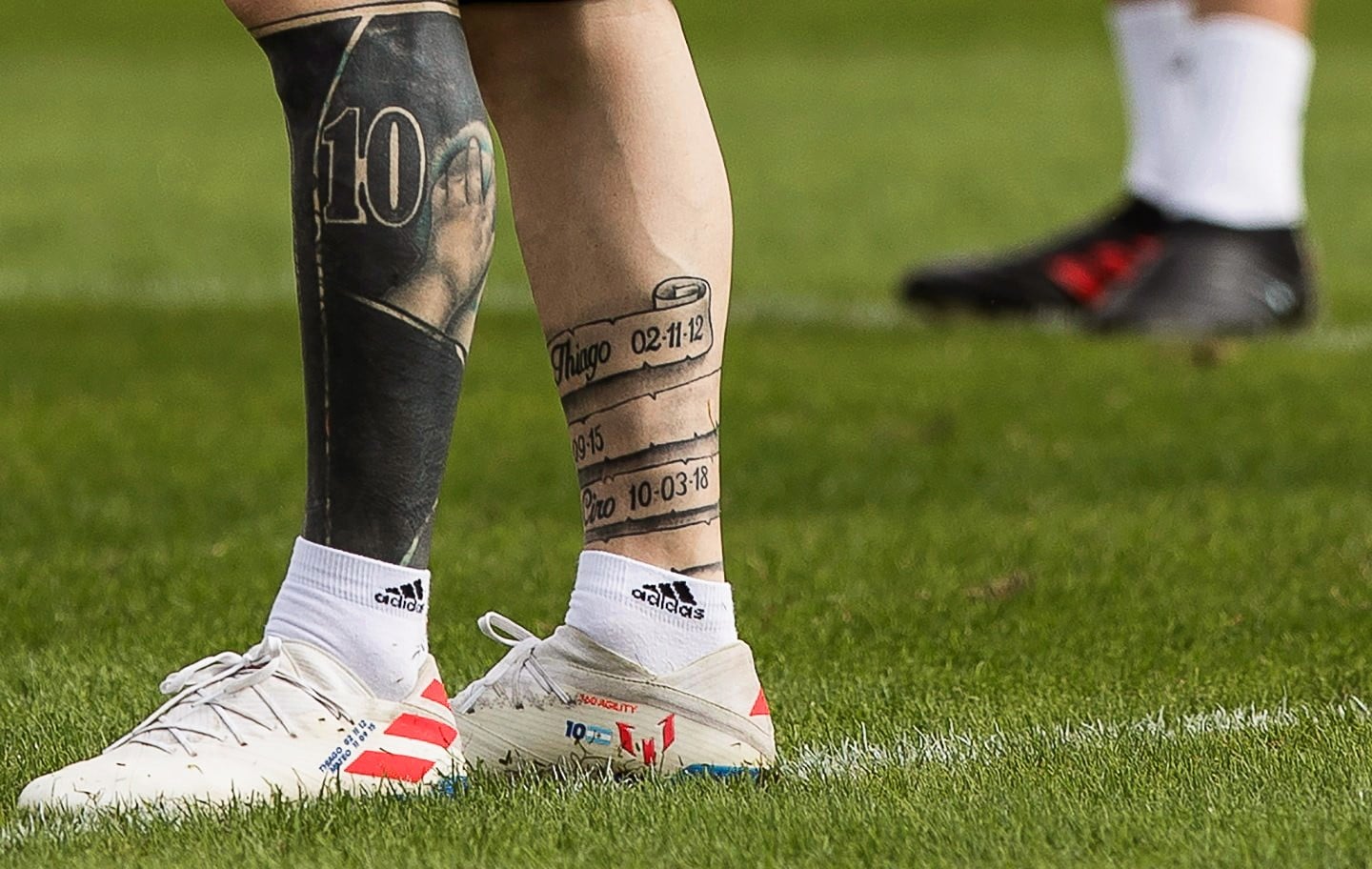 Lionel Messi leg tattoos and family names