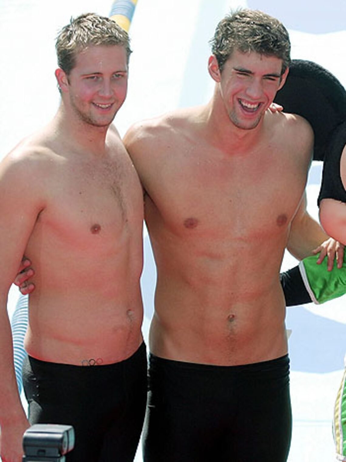 Michael Phelps showing the Olympic rings tattoo on his hip