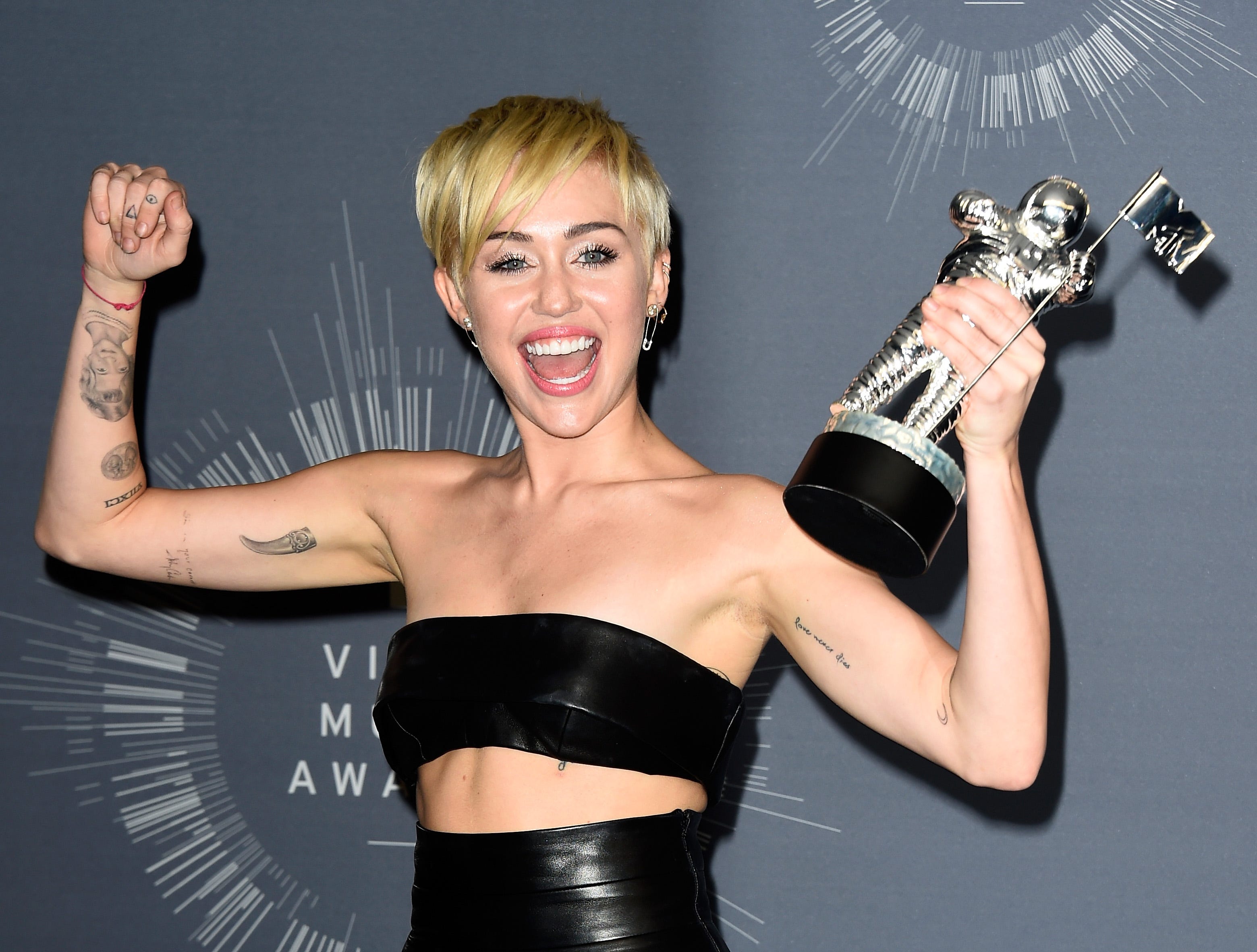 Miley Cyrus forearm tattoo detail