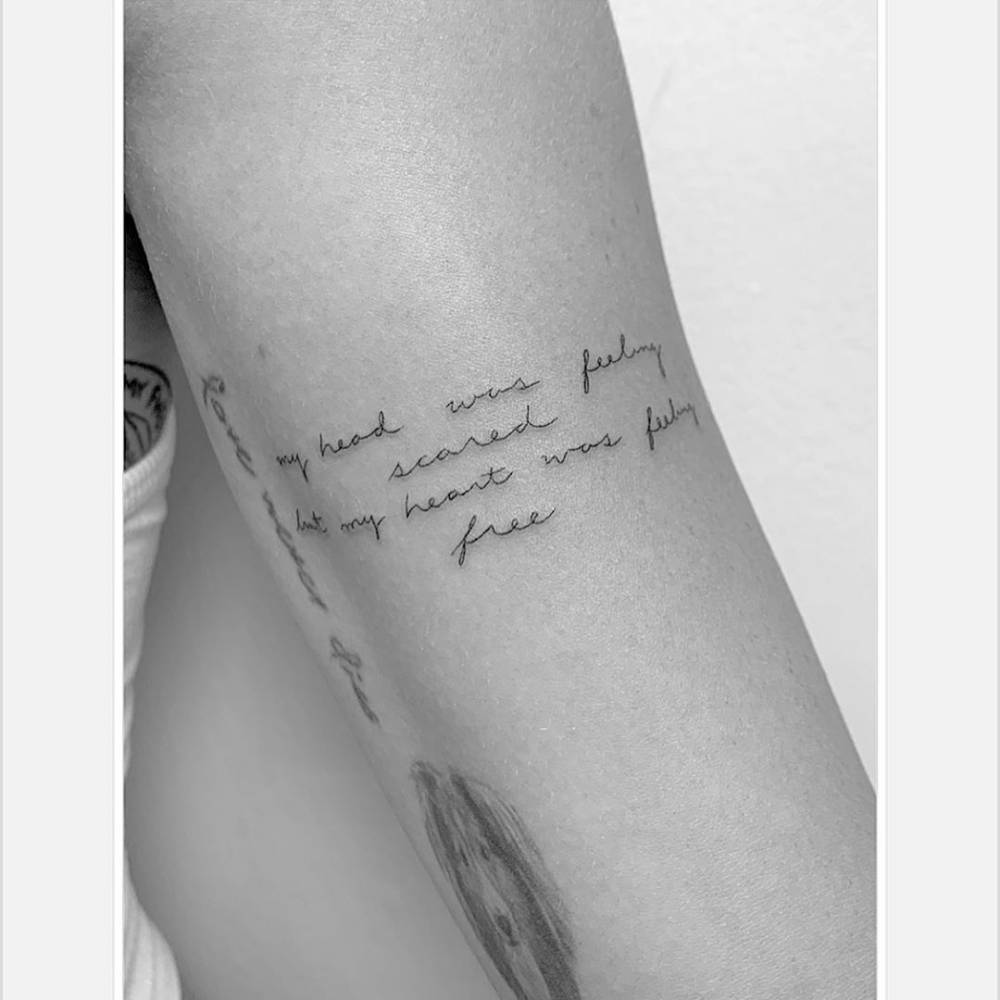 Miley Cyrus’s Pixies lyric tattoo on her upper arm