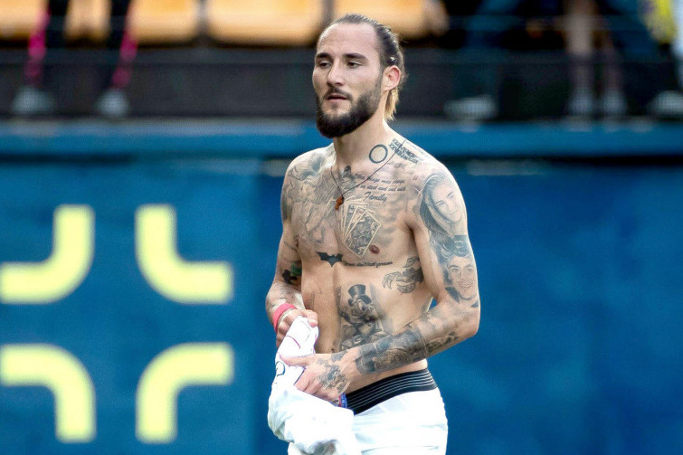 Nemanja Gudelj family portrait tattoos across his chest and arms