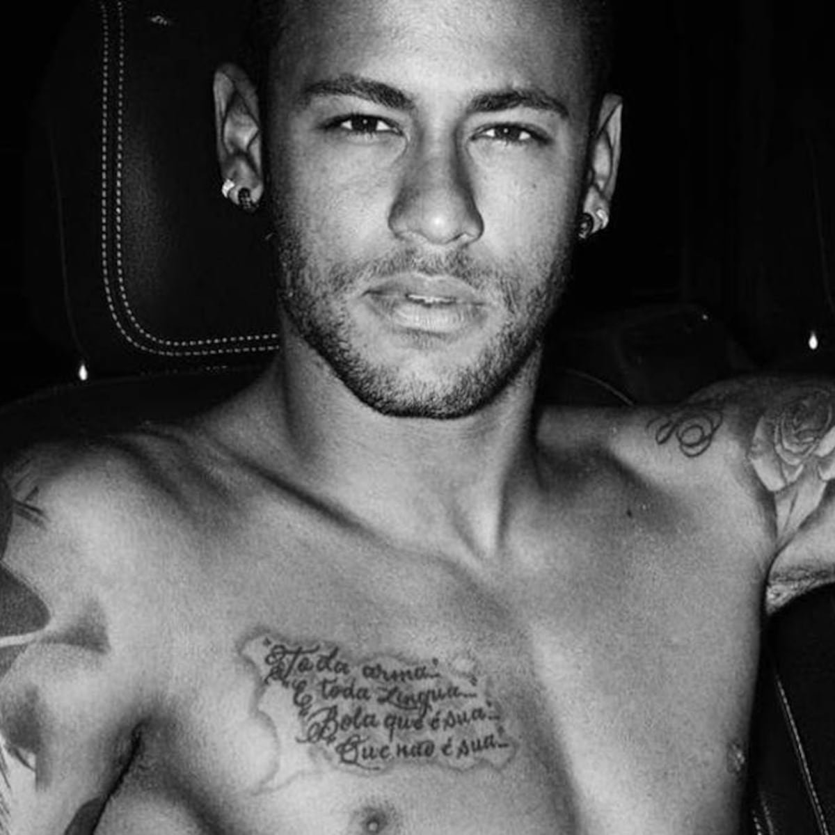 Neymar chest script tattoo in a shirtless close portrait