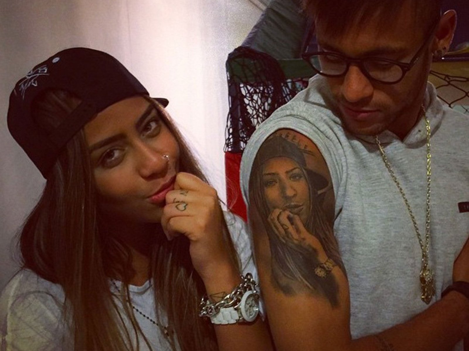 Neymar Rafaella portrait tattoo on upper arm