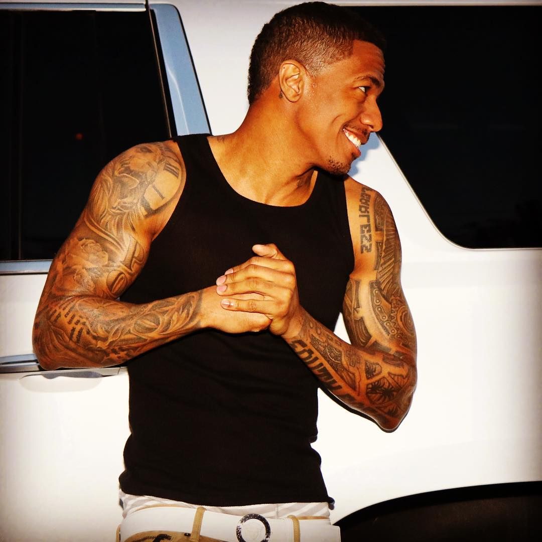 Nick Cannon portrait showing extensive arm and back tattoo coverage