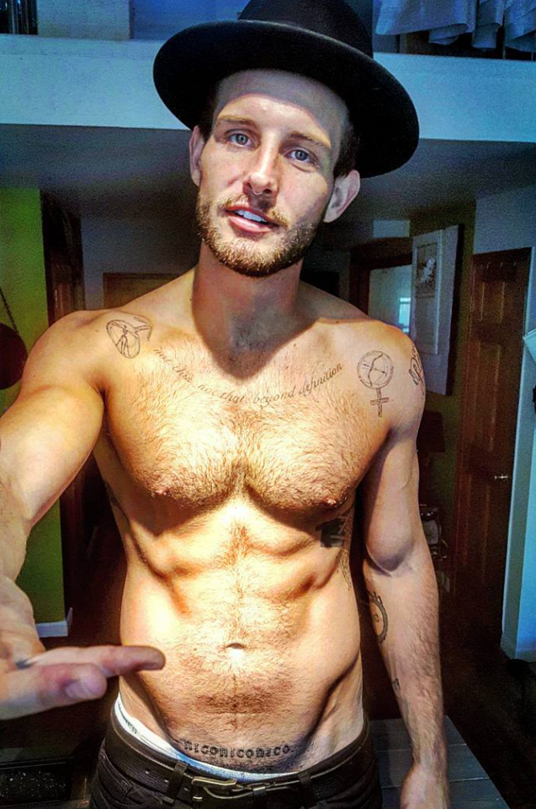 Nico Tortorella script and symbol tattoos