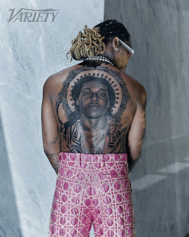 Offset showing the large Takeoff portrait tattoo across his back.
