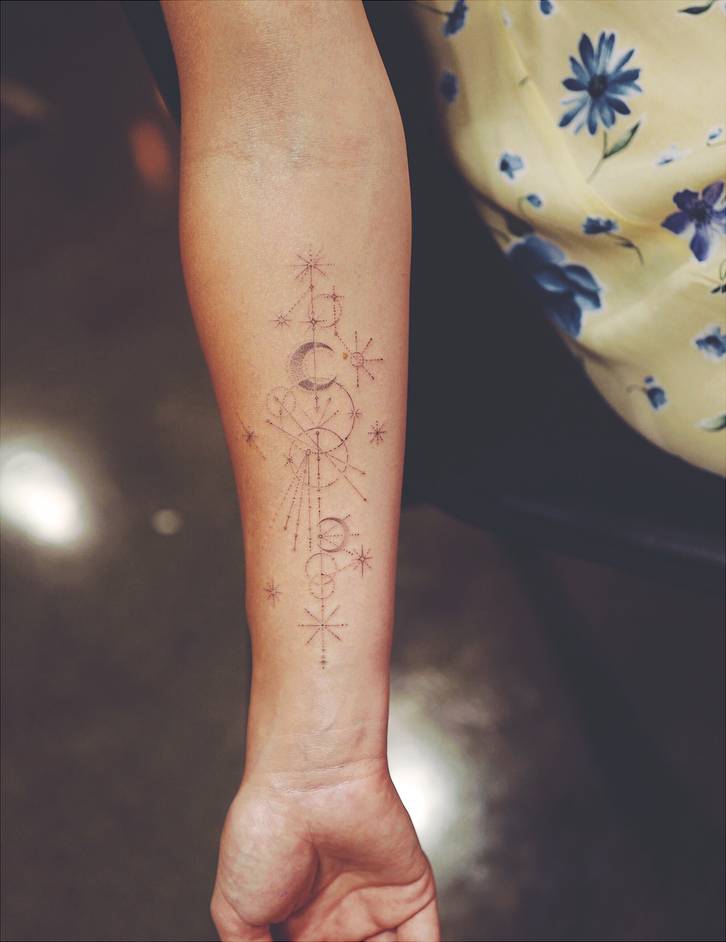 Olivia Wilde constellation and moon forearm tattoo