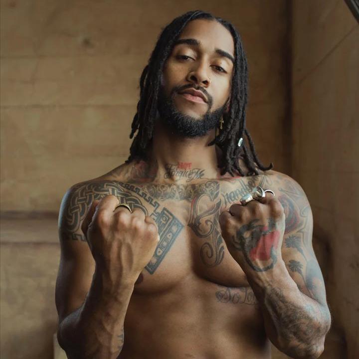 Omarion chest and hand tattoos