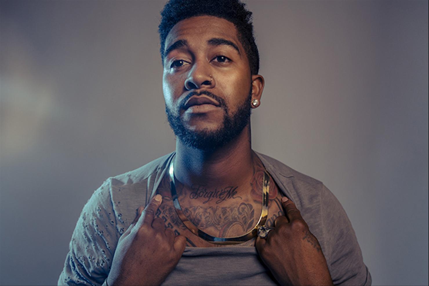 Omarion chest and arm tattoos portrait