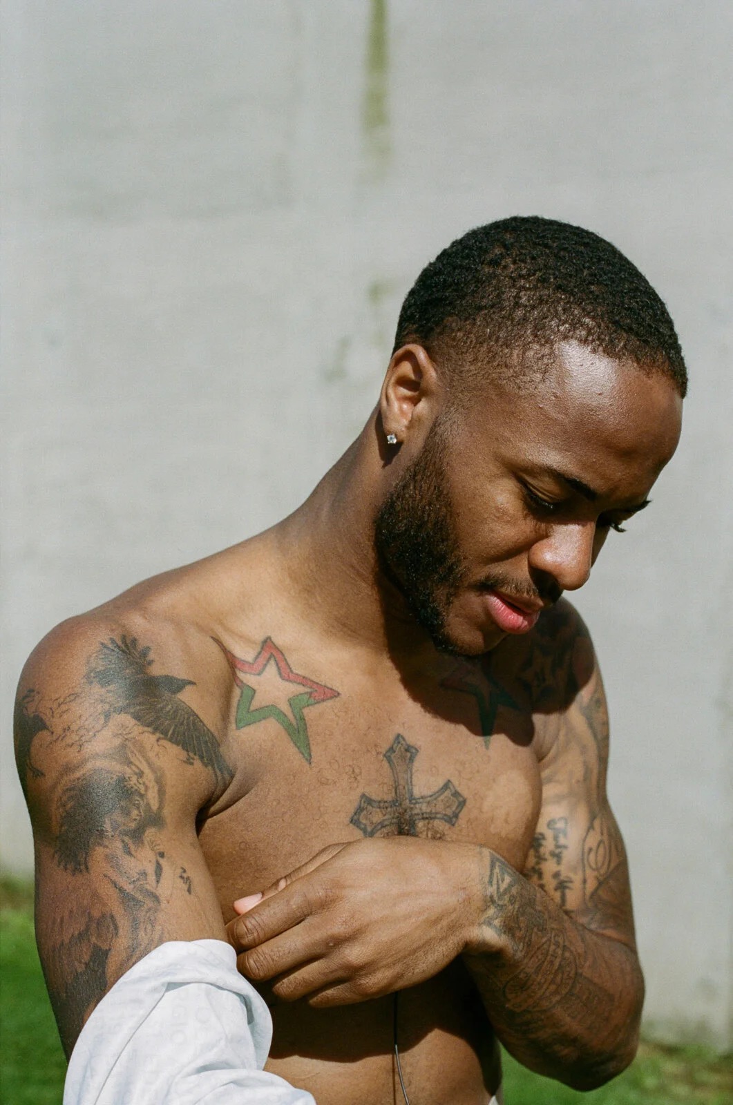Raheem Sterling tattoos: large tattoo-specific portrait showing the chest and surrounding arm work