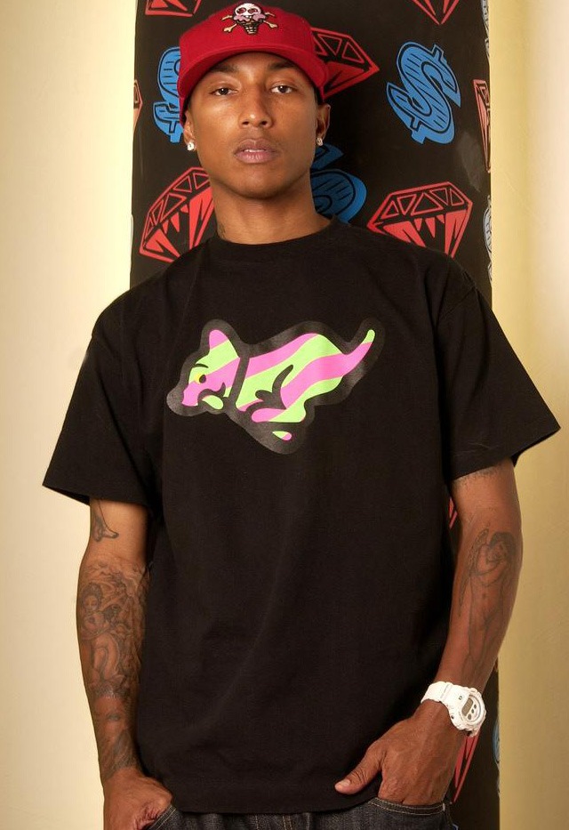 Pharrell Williams cherub and arm tattoos
