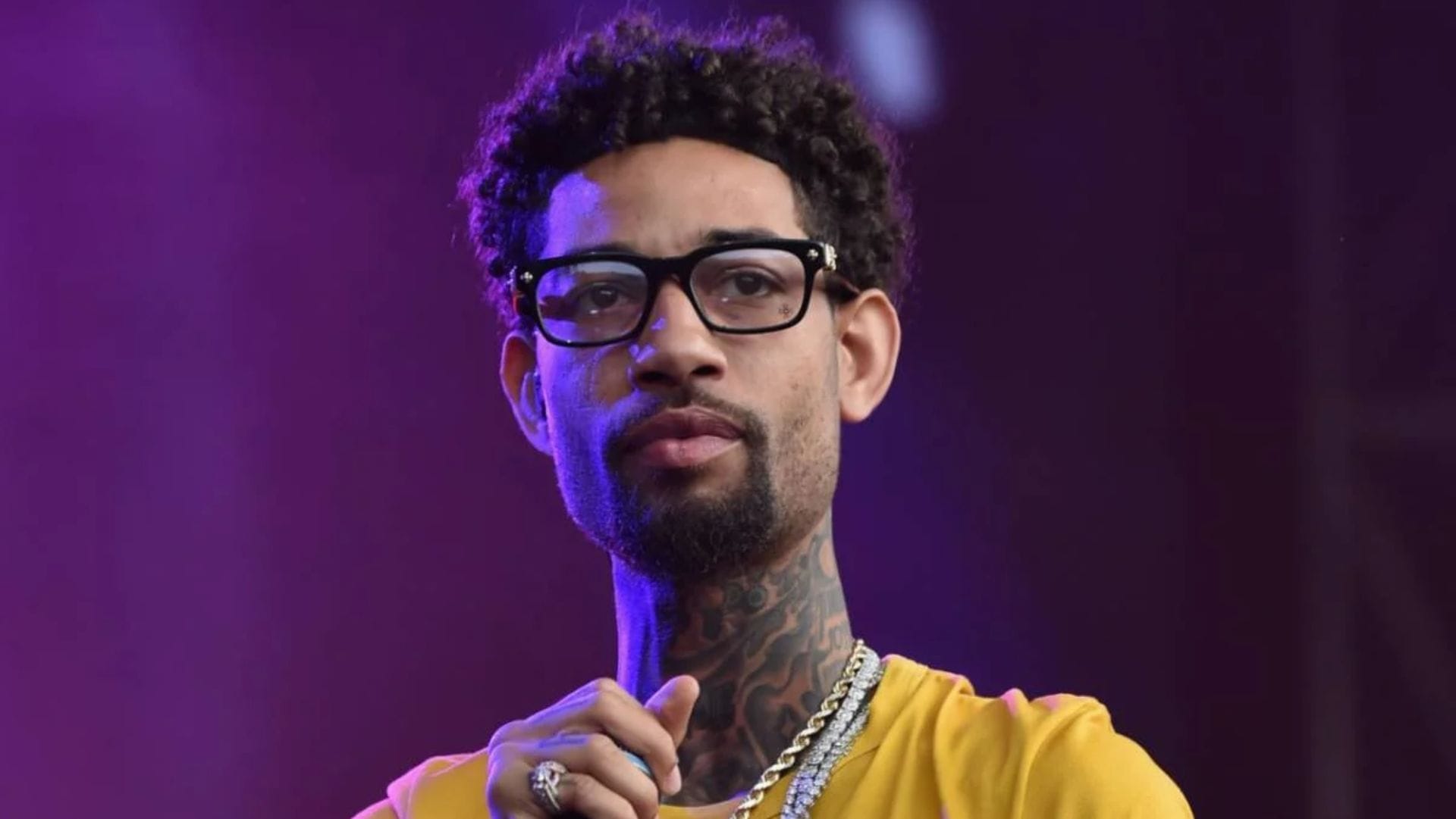 PnB Rock stage neck tattoos