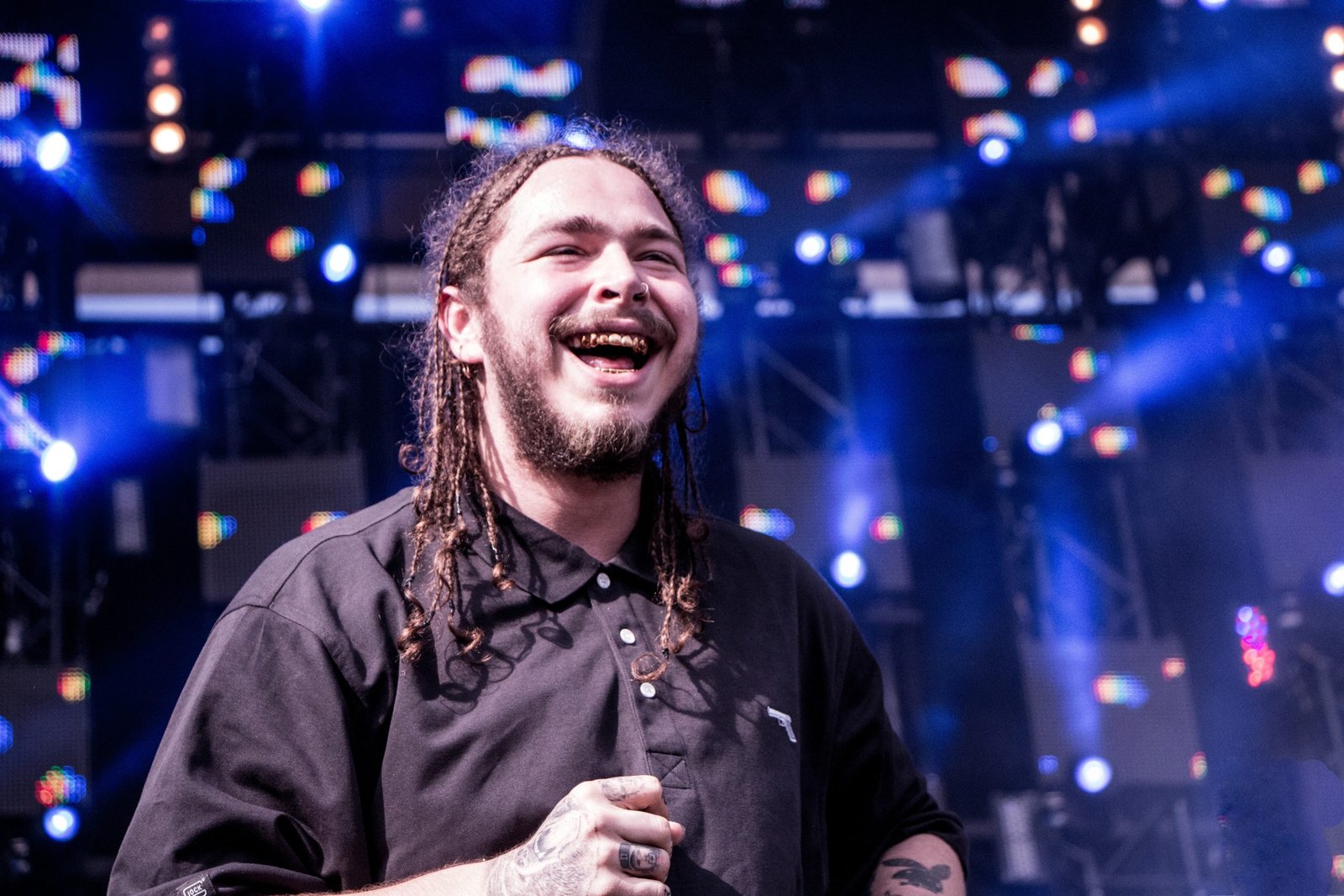 Post Malone hand and finger tattoos