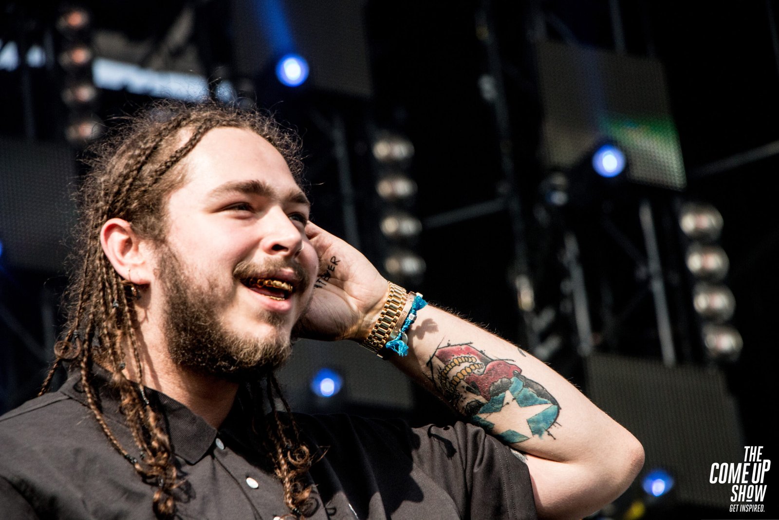 Post Malone arm and face tattoos