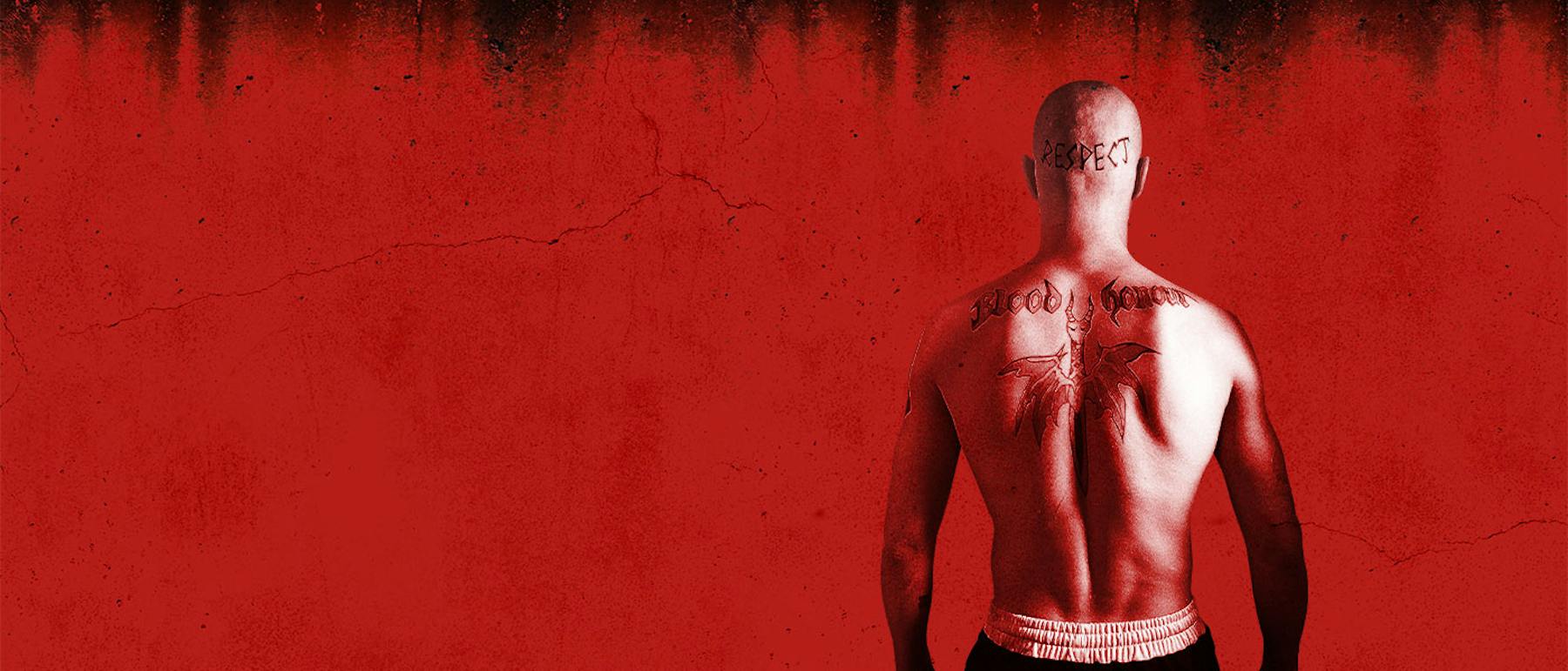 Mads Mikkelsen as Tonny with RESPECT, Blood and Honour lettering and a winged back tattoo