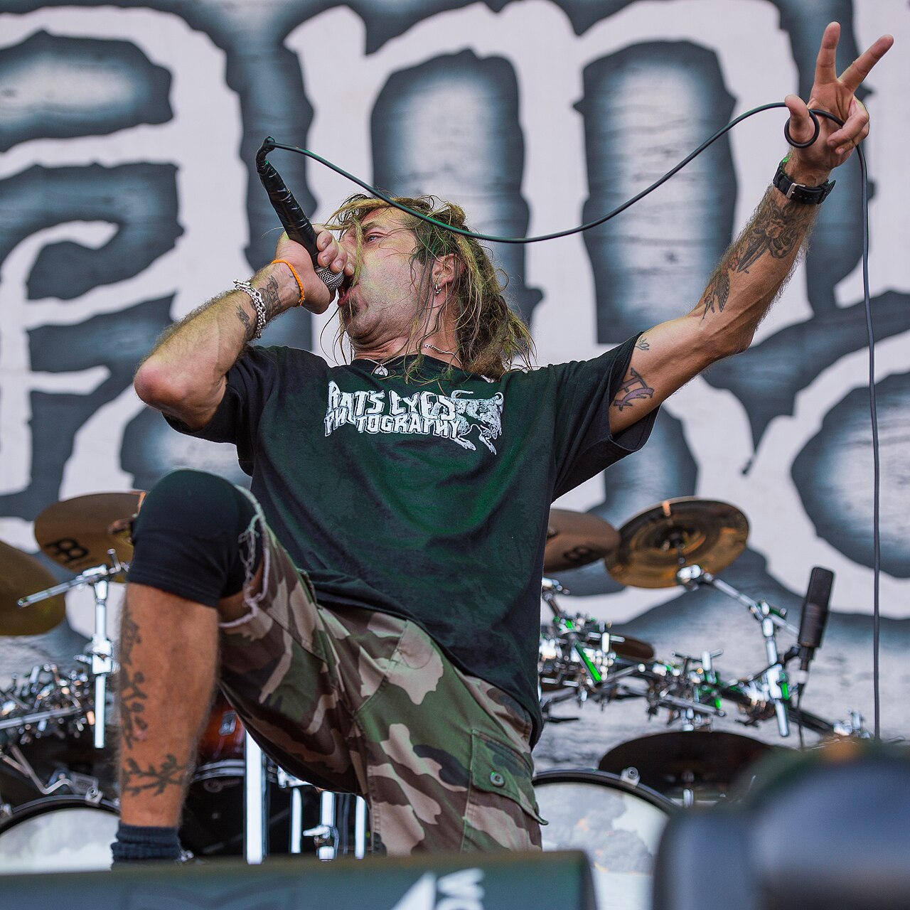 Randy Blythe arm tattoos with microphone