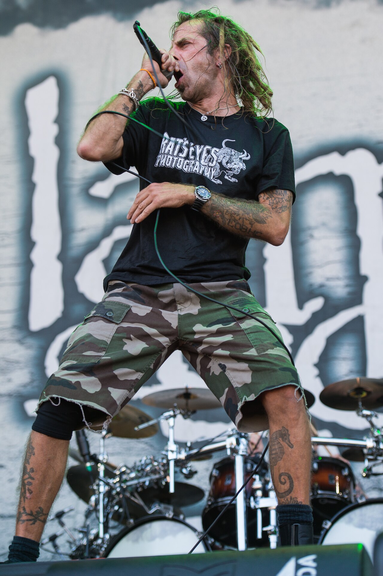 Randy Blythe forearm and leg tattoos onstage