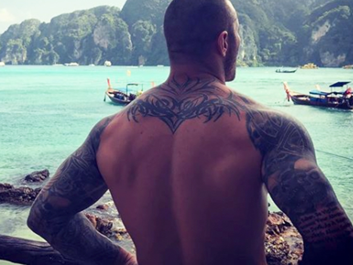 Randy Orton’s back tattoo in a later wrestling-era photograph