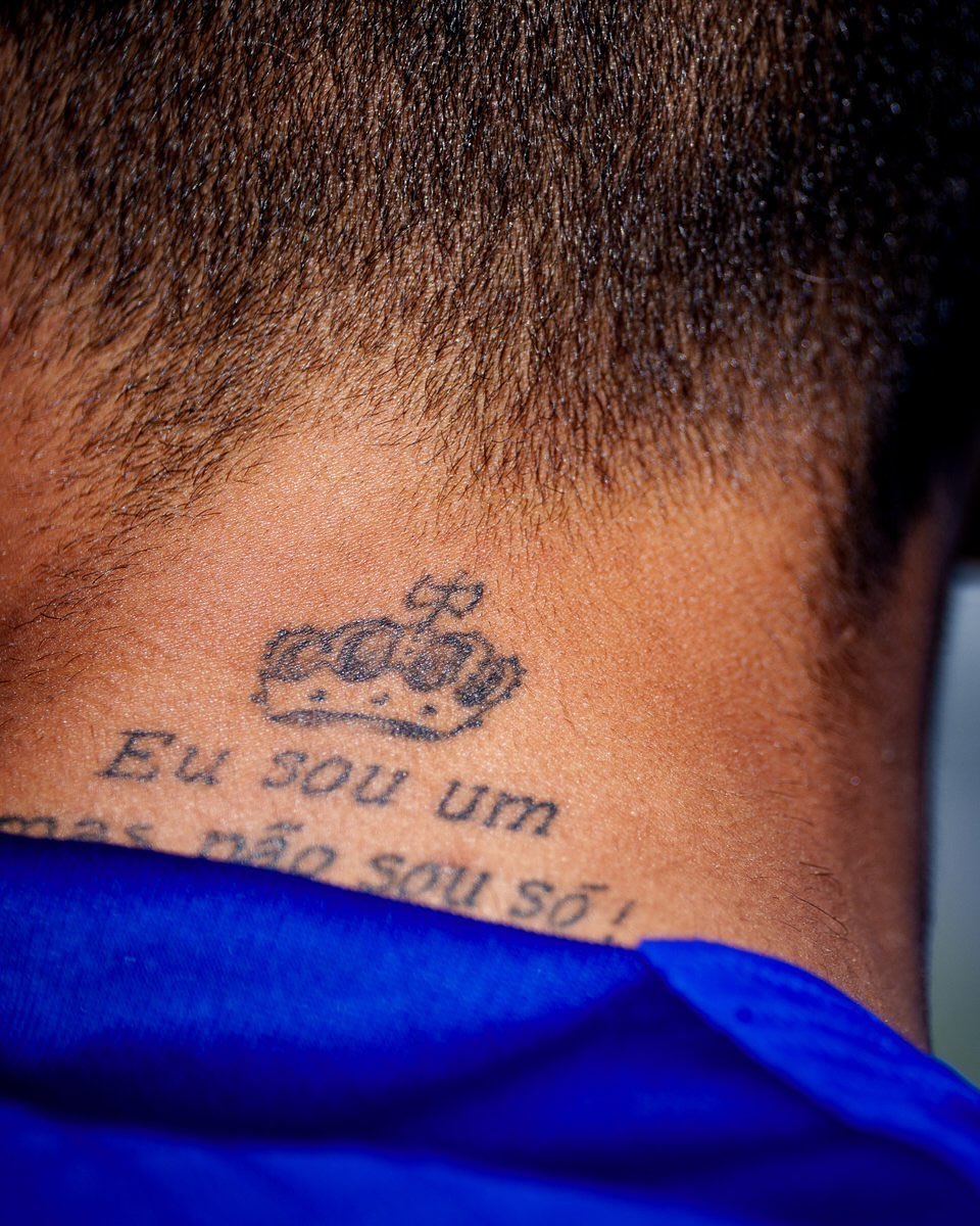 Raphinha visible tattoos across his neck, arms and hands