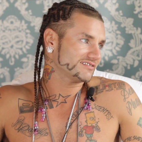 Riff Raff Bart Simpson chest tattoo