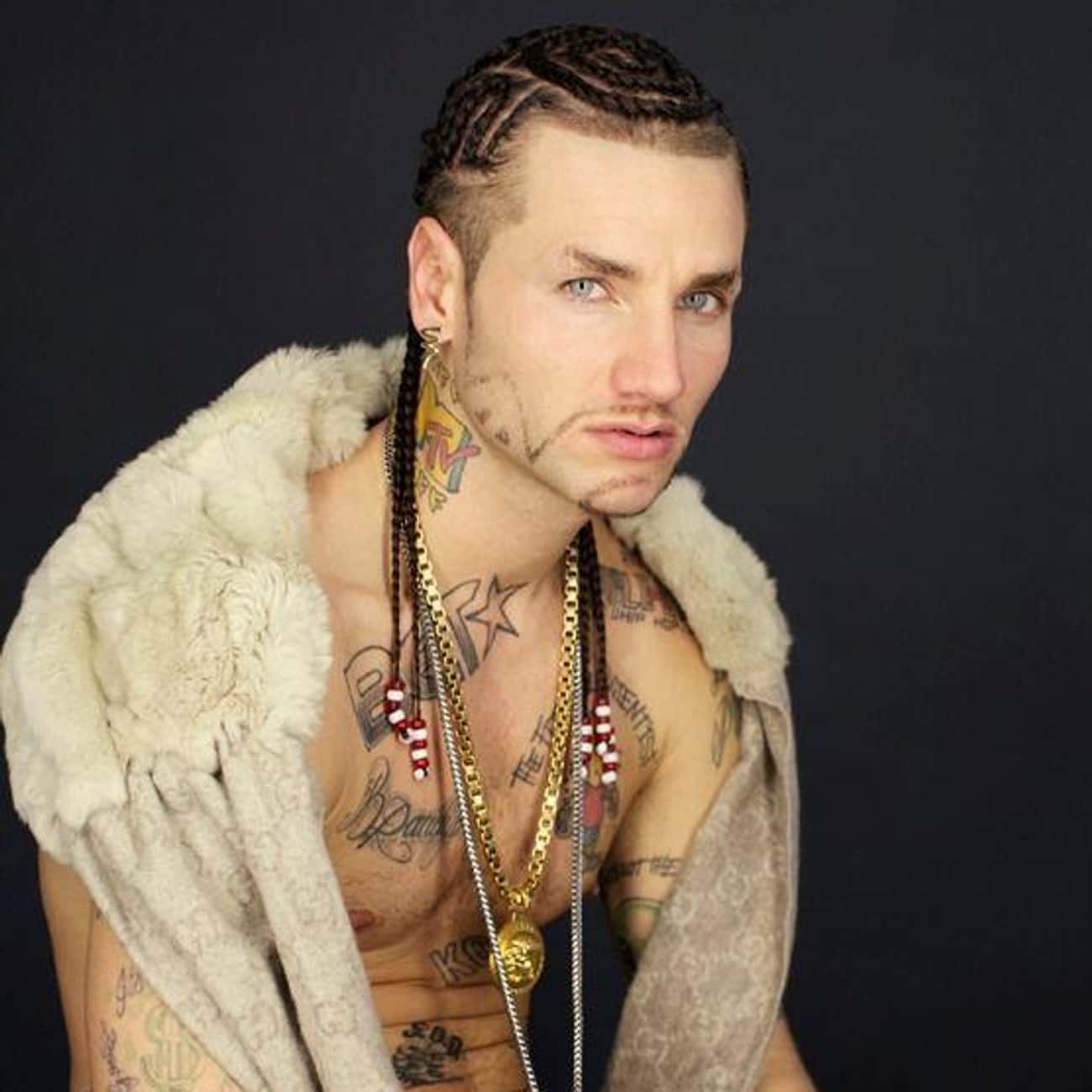 Riff Raff neck and chest tattoos