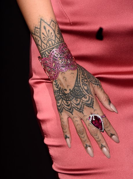 Rihanna henna-style mandala tattoo on her hand