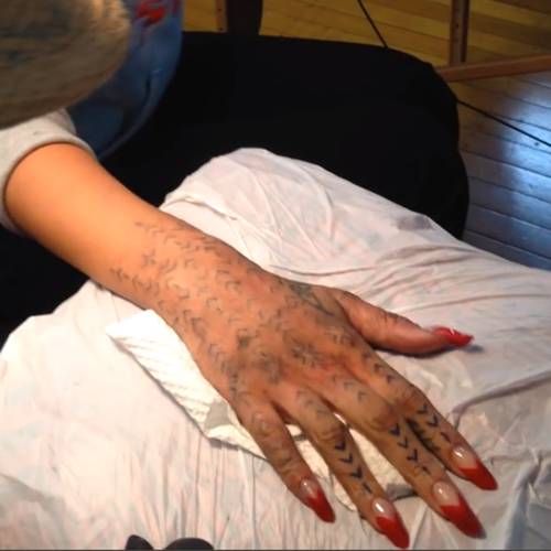 Rihanna Maori hand tattoo