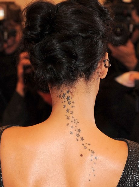 Rihanna star trail tattoo from neck to back