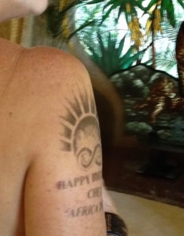 Rita Wilson upper arm sun and infinity tattoo