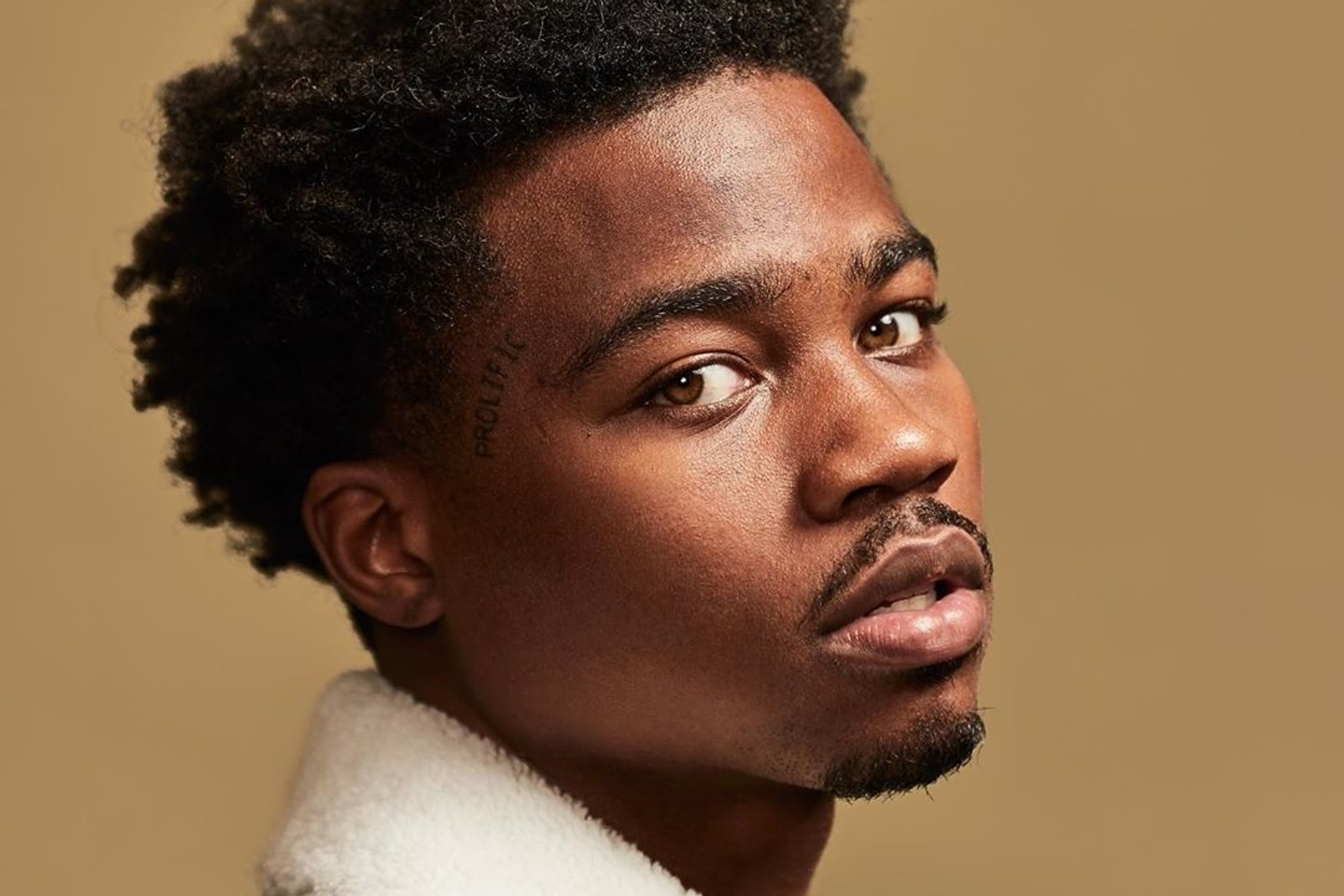 Roddy Ricch Prolific face tattoo