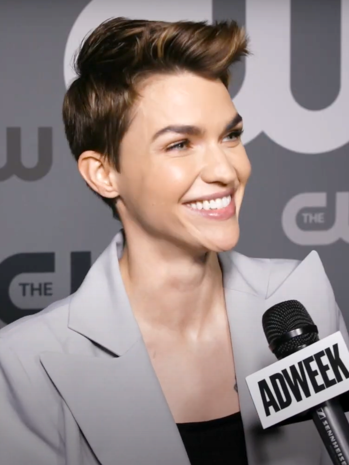 Ruby Rose showing her back heart tribute tattoo area
