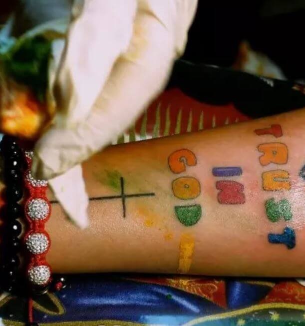 Ruby Rose Pantone-style colour swatch tattoos on the wrist