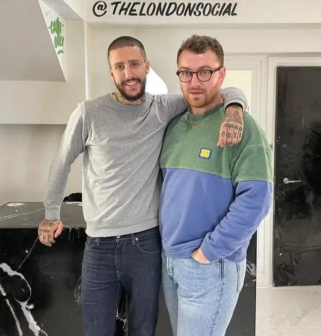 Sam Smith with tattoo artist and new ink