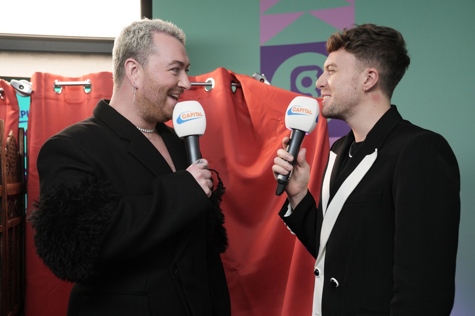 Sam Smith hand and arm tattoos during performance