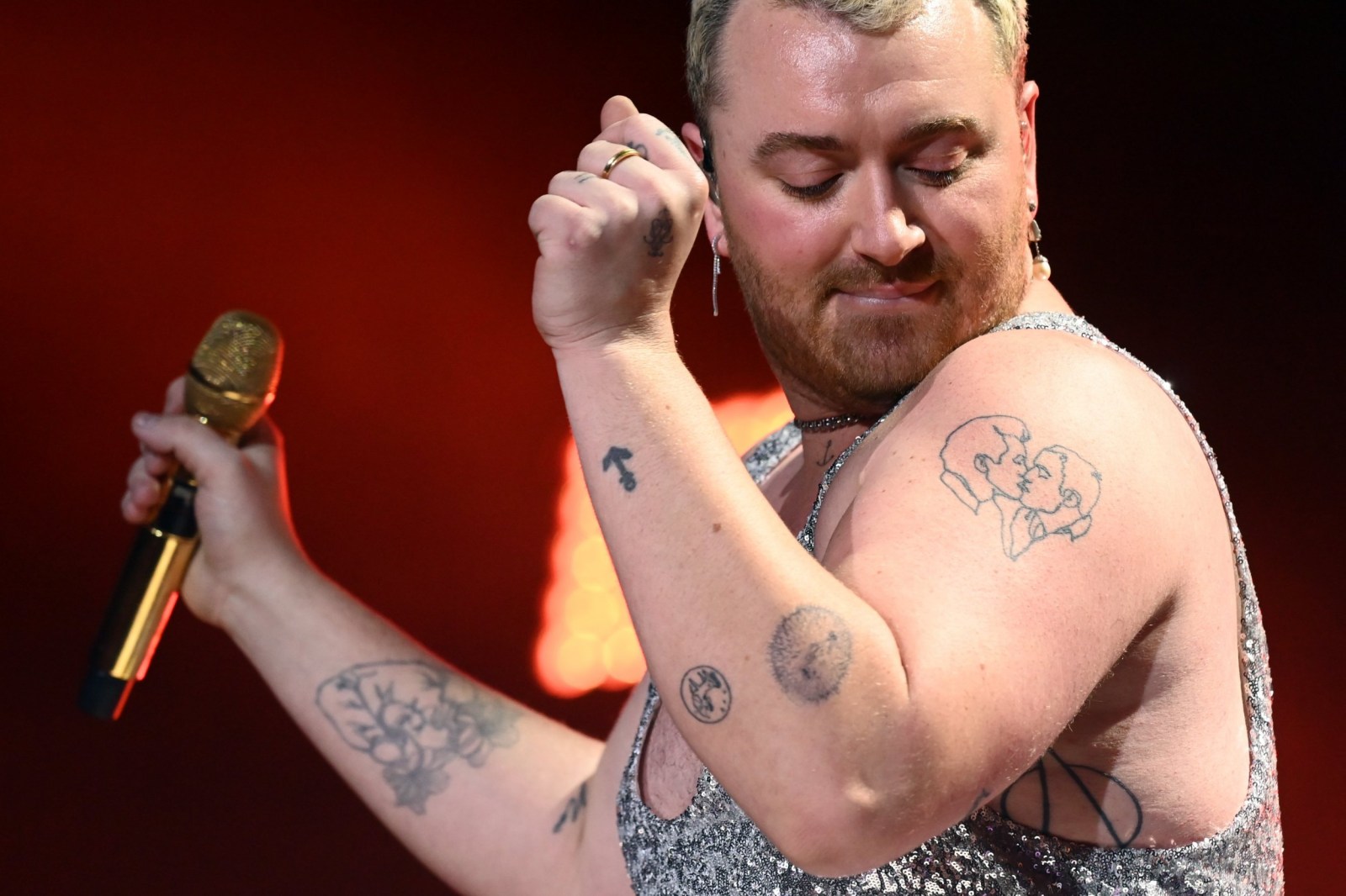 Sam Smith tattoo collection visible on stage