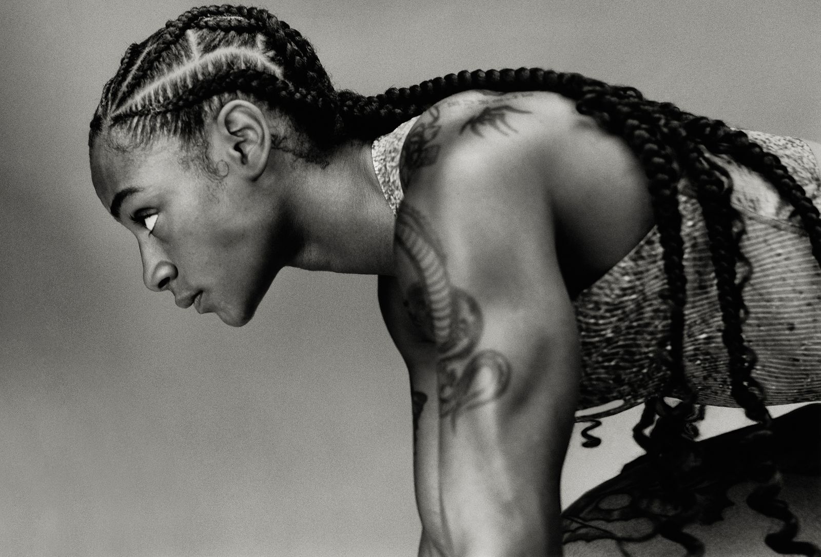 Sha’Carri Richardson floral back tattoo