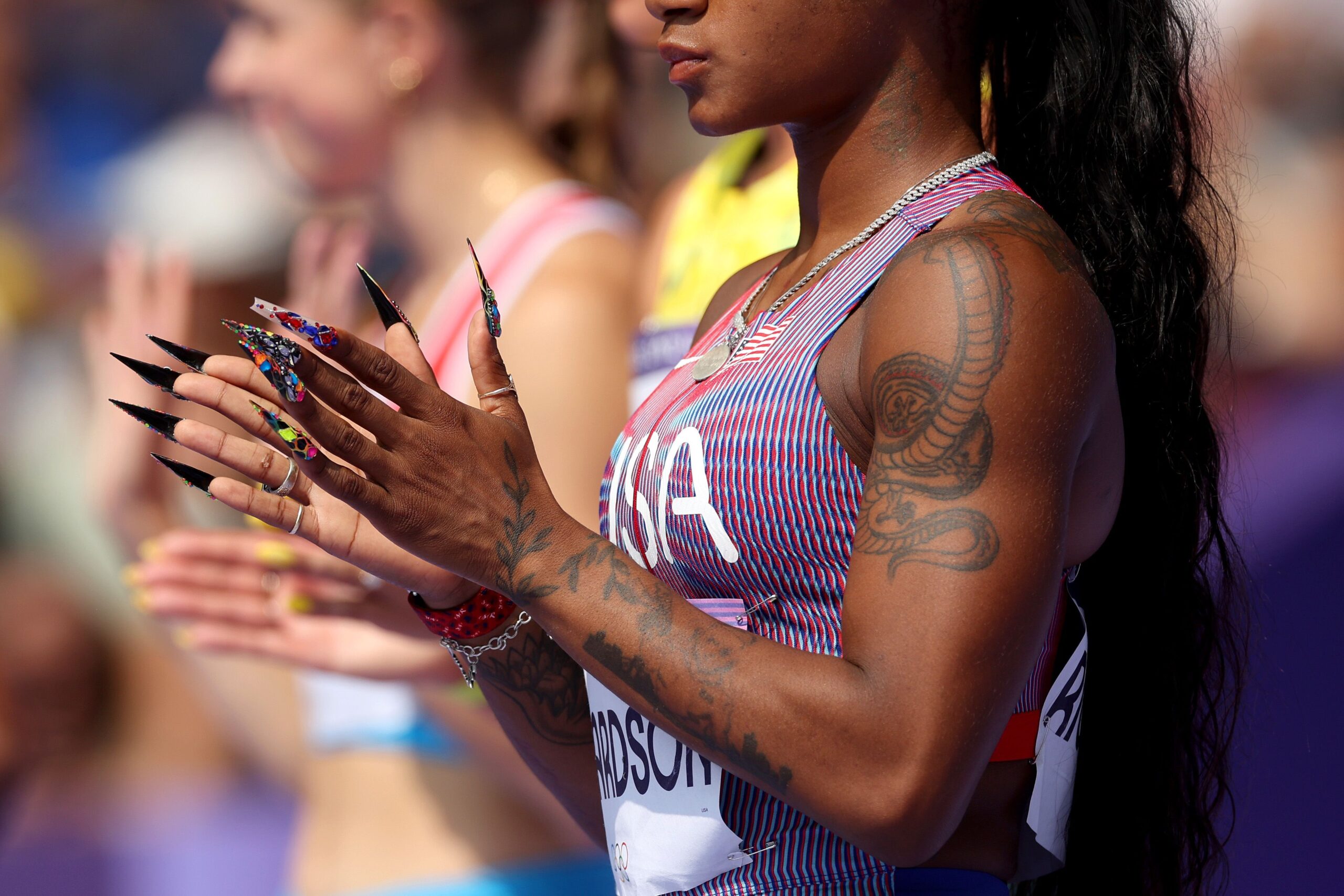 Sha’Carri Richardson snake and arm tattoos