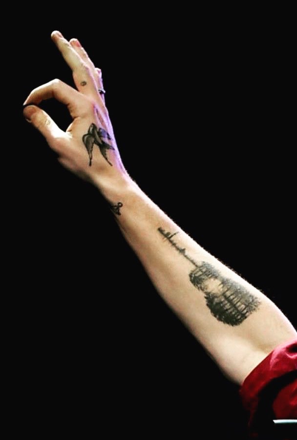 Shawn Mendes guitar tattoo on the forearm