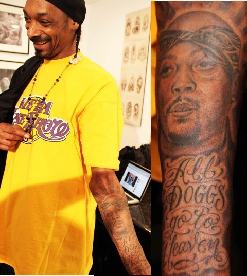 Snoop Dogg showing the Nate Dogg memorial portrait and All Doggs Go To Heaven lettering