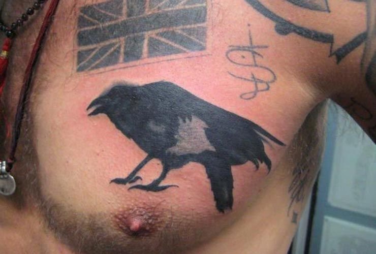 Tom Hardy showing wolf and raven designs