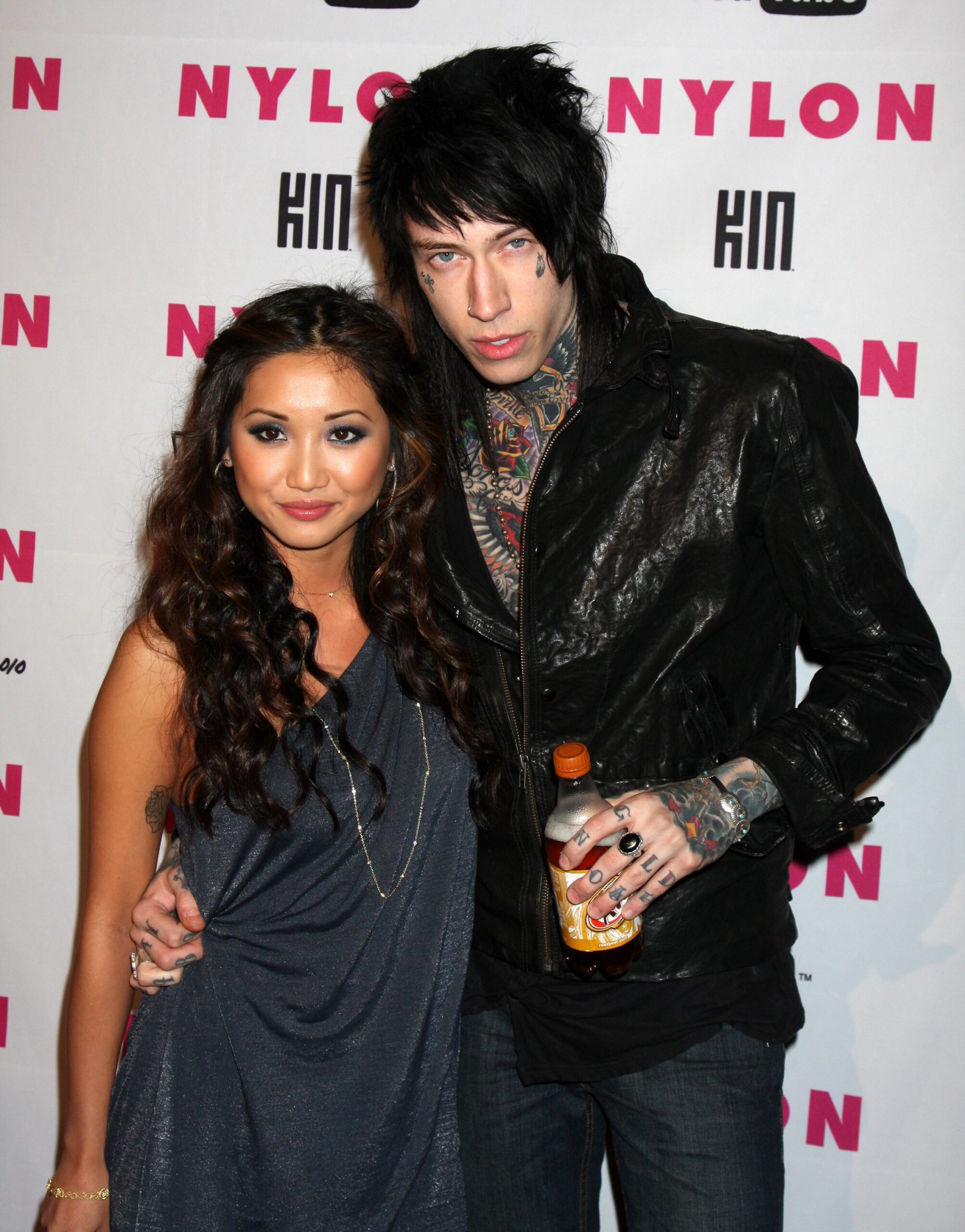 Trace Cyrus face neck and hand tattoos at an event