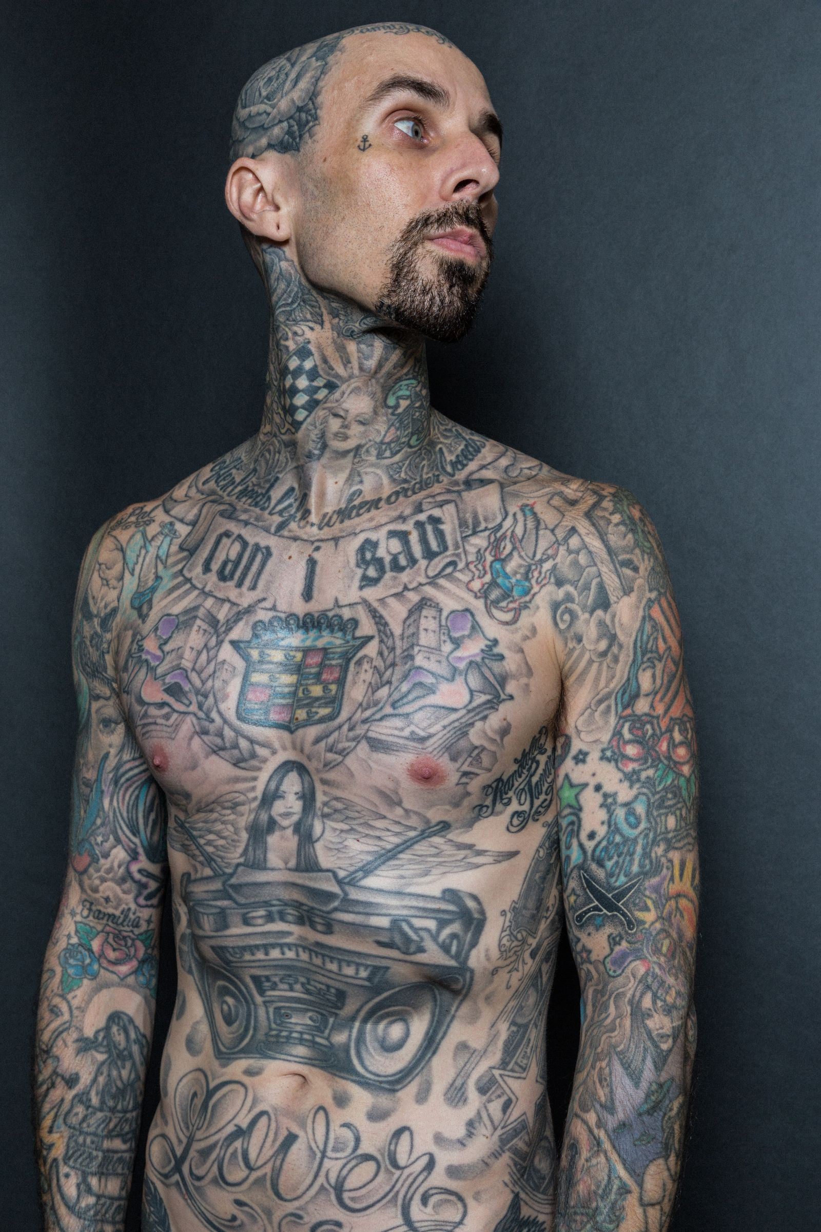 Travis Barker showing his changing tattoo collection