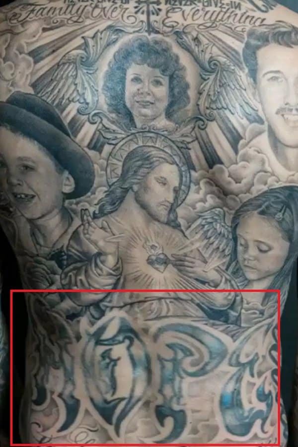 Travis Barker Hope tattoo across his lower back
